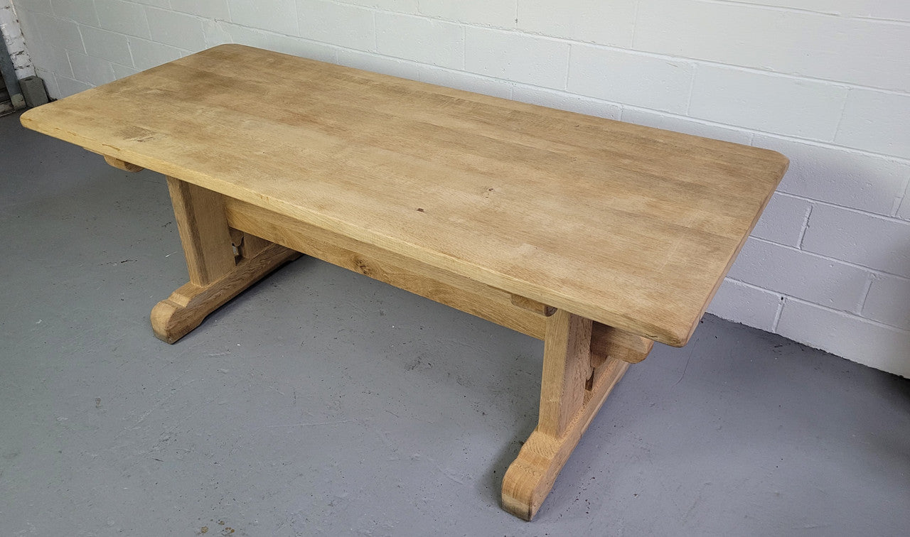 Late 19th century French stripped Oak double pedestal stretcher base Farmhouse table. Features raw wood that could be used as is for a distressed look, or finished and waxed for a more refined look.