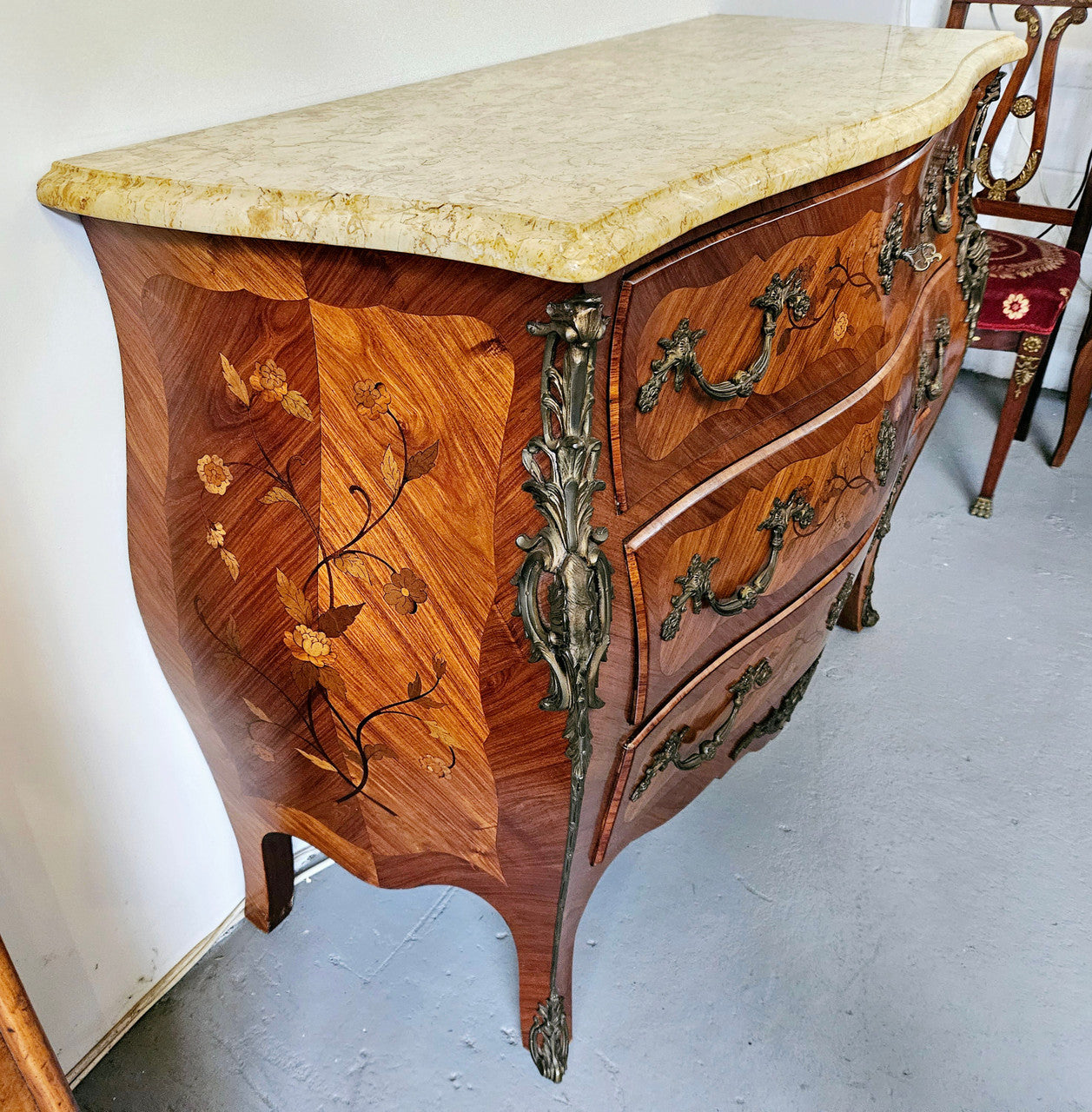 Stunning French Louis 15th style marble topped three drawer commode with marquetry inlay and stunning ormolu mounts. In good original detailed condition.