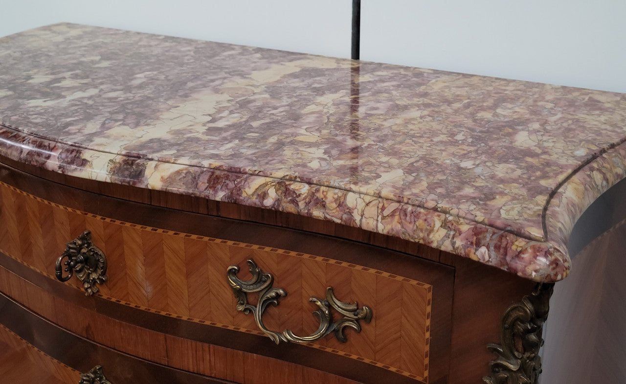 Walnut Louis XV style marble top abbattant with beautiful parquetry inlay and ormolu mounts. It has plenty of storage space with four large drawers and four smaller internal drawers. Beautiful drop down desk with a leather insert. In very good original detailed condition.