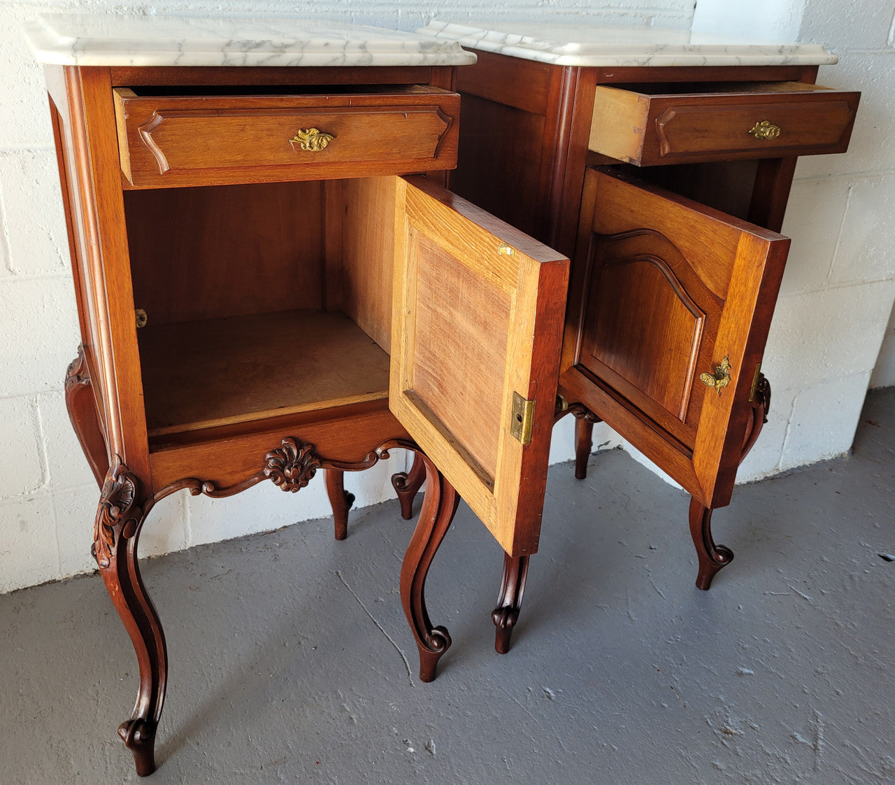 Pair of Louis XV style Walnut bedside cabinets marble top. Circa 1900 and in good original detailed condition.