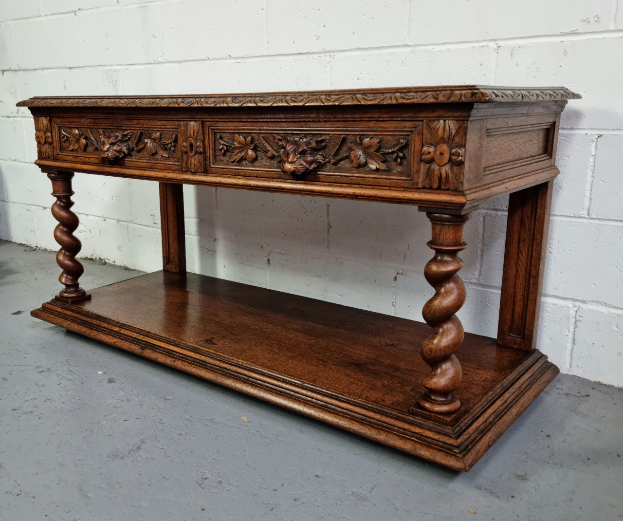Antique French Oak Henry II style two drawer cabinet which would make an ideal TV cabinet or music unit. In good original detailed condition.
