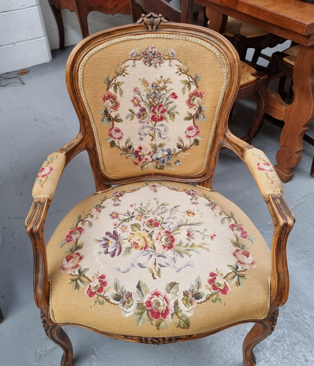 Louis XV style Walnut and tapestry armchair. Very comfortable to sit in and tapestry is in good original used condition.
