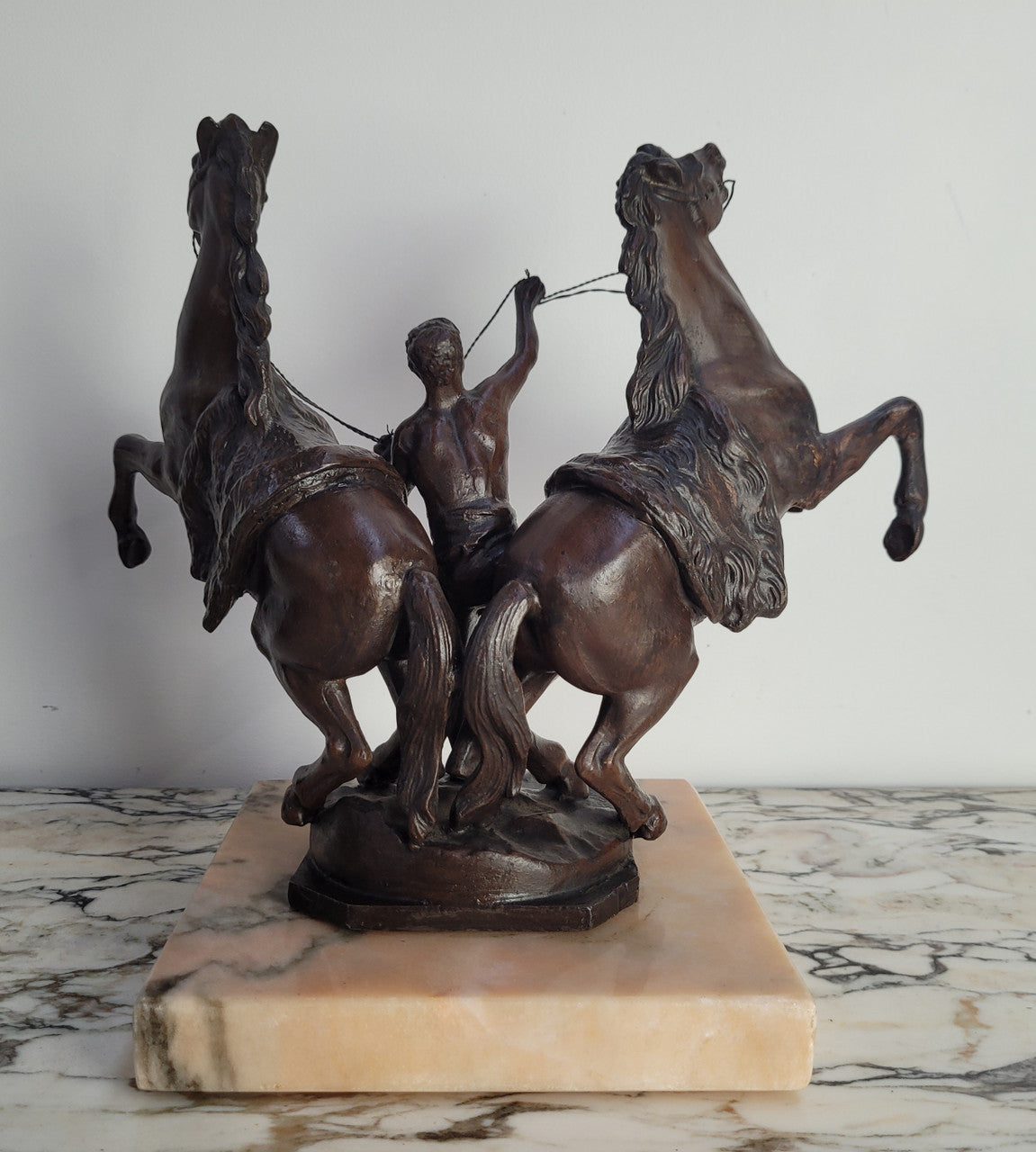 French Art Deco cold painted bronze metal marley horses style statue on a marble base. It is in good condition.
