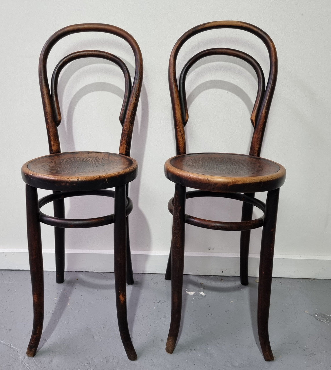 Rare petite cafe Bentwood chairs with original shell embossed seats. They are in very good original condition. They would make great addition to your breakfast bar.