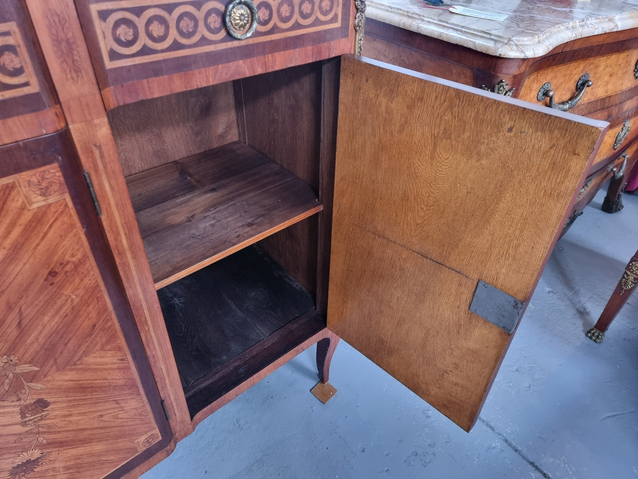 A high quality 19th Century French marquetry inlaid Kingwood marble top credenza. It has an attractive solid marble top and decorative marquetry inlay throughout. It has plenty of storage space with three drawers and three doors. It has been sourced from France and is in good original detailed condition.
