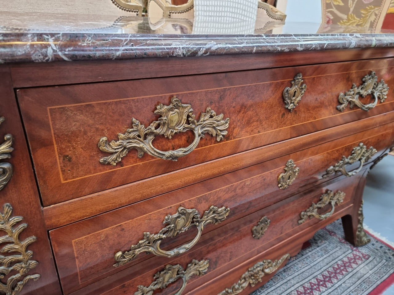 French Louis XVI style three drawer commode with amazing coloured marble. It has decorative brass mounts and is in very good original detailed condition.