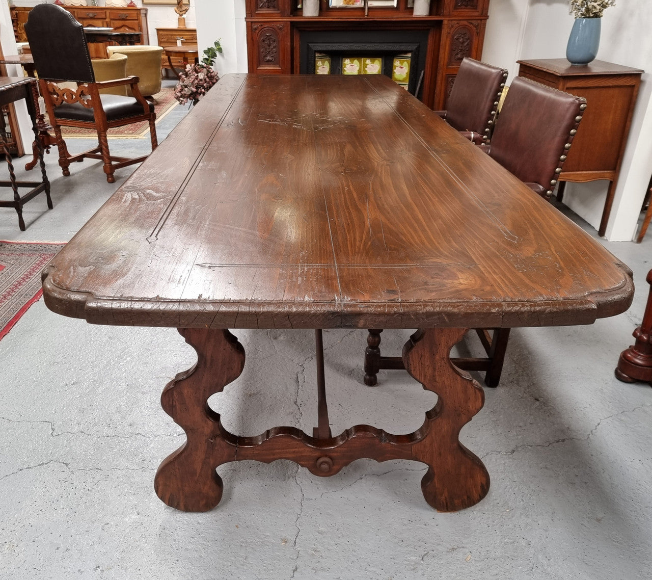Amazing hard to find French Fruitwood Spanish style 3 meter dining table. Decorative iron work underneath and in good detailed original condition.