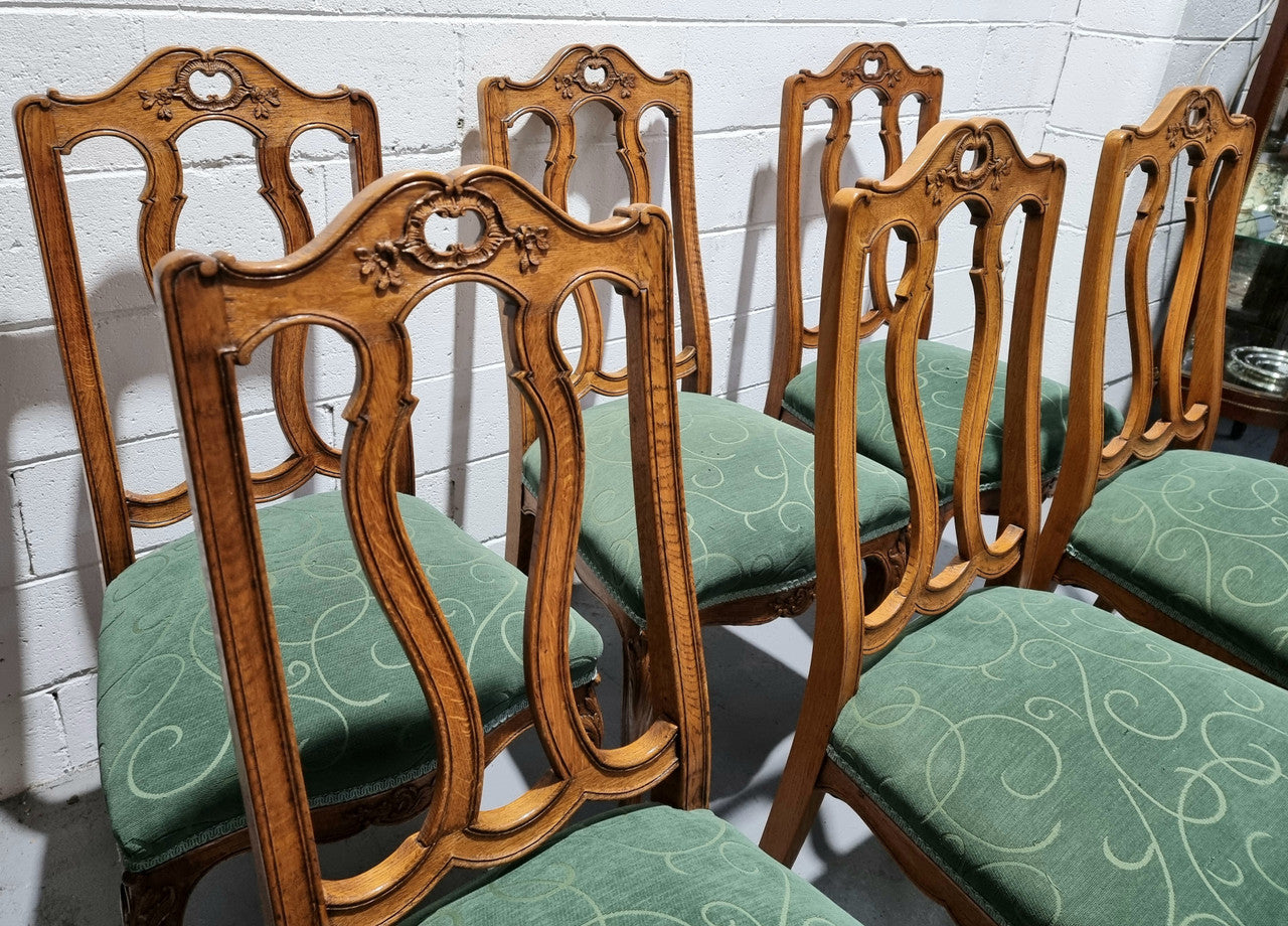 Set of six French style Oak decorative upholstered seat dining chairs. They are comfortable to sit in and are in good original condition, please view photos of fabric as the fabric is in good used condition.