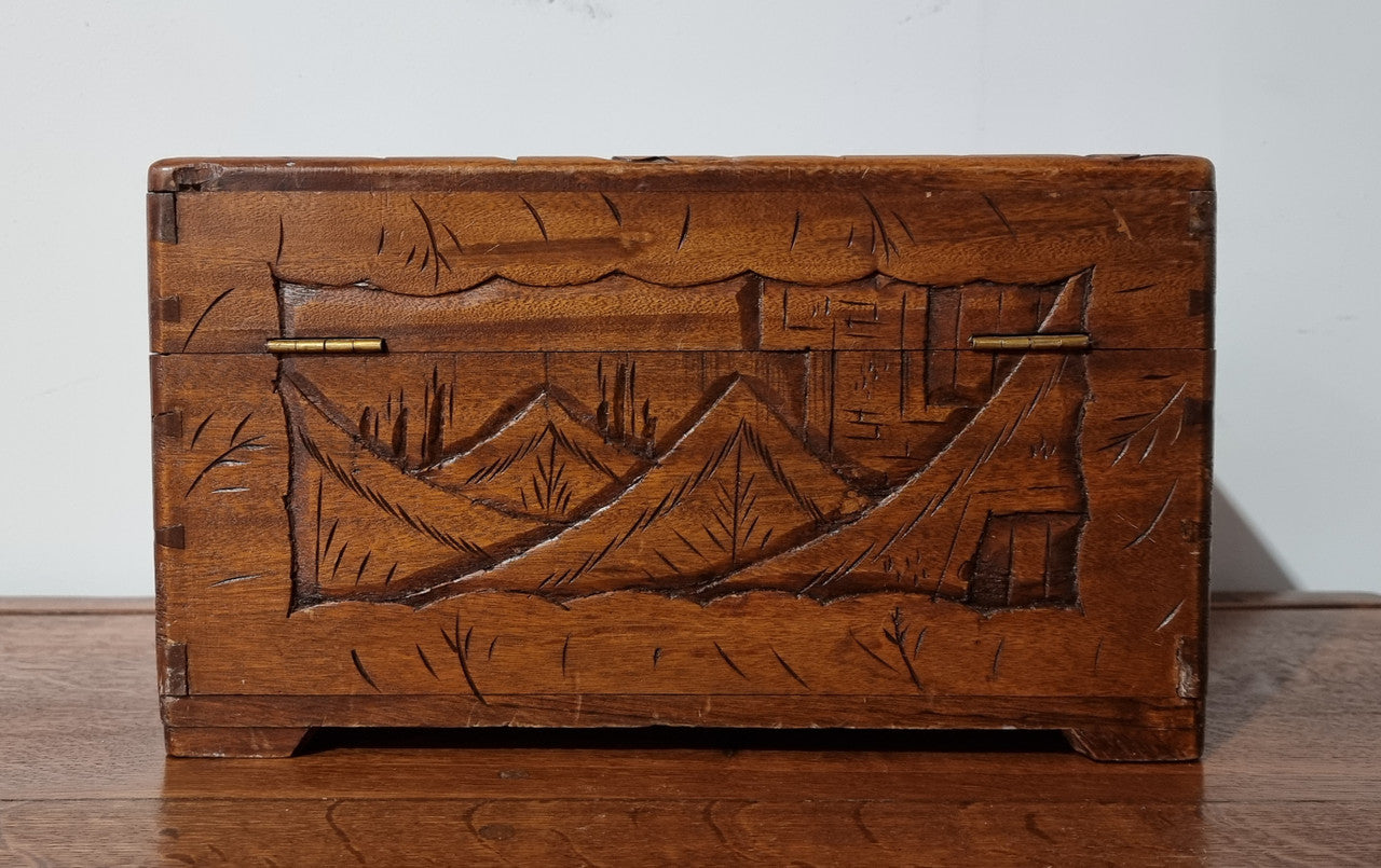 Small Chinese carved camphor wood jewellery box. It is in original condition.