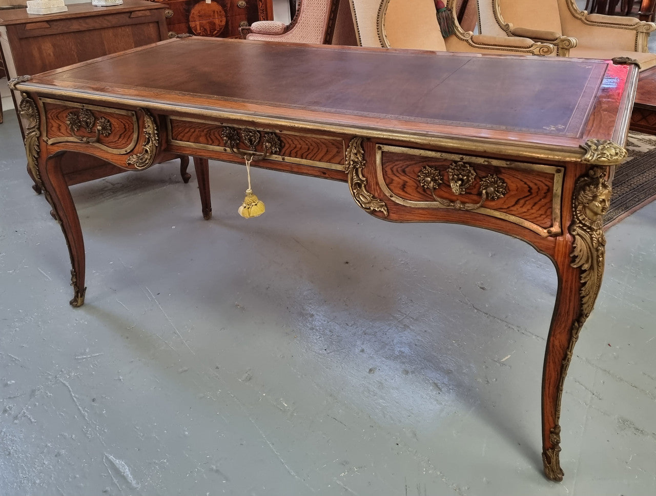Beautifully fully restored French Antique Rosewood partners desk with beautiful ormolu detail and lovely tooled new leather top. There are three functioning drawers on one side for all your storage needs.