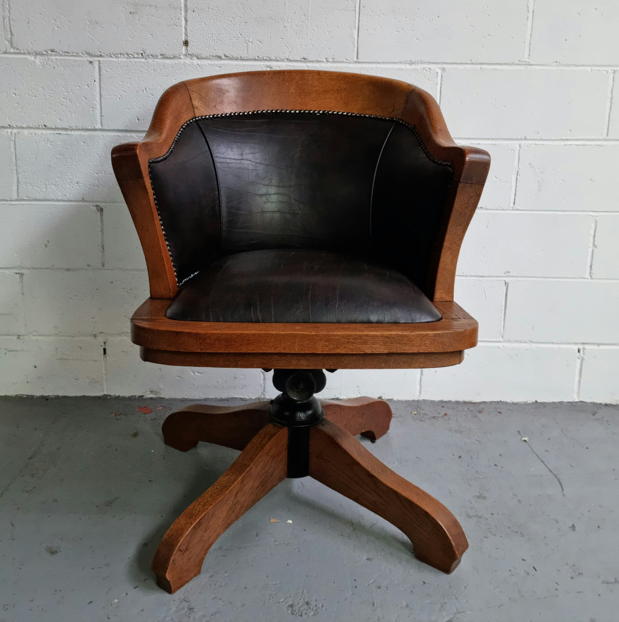 Antique French Oak newly upholstered "swivel action" office desk chair. In very good condition and very comfortable to sit in.
