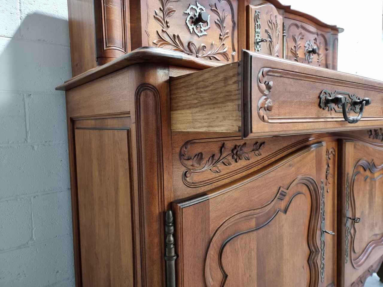 Stunning 19th Century French Walnut Buffet à Glissant from Provence, France. This is an exceptional charming piece and very functional with plenty of storage space, two large cupboards at the bottom, two drawers in the middle and two sliding doors either side at the top and finished off with a small central cupboard. In good original detailed condition.