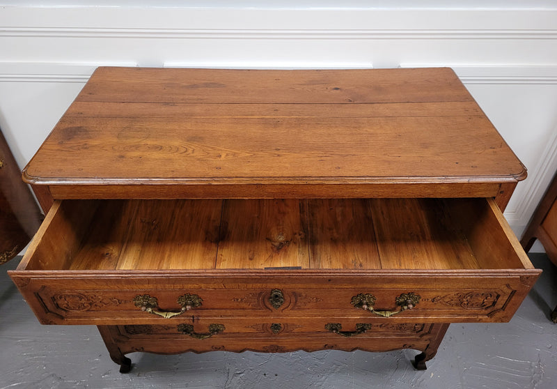 French Louis 15th style large three drawer chest featuring carved drawers. It has been sourced from France and is in good original detailed condition.