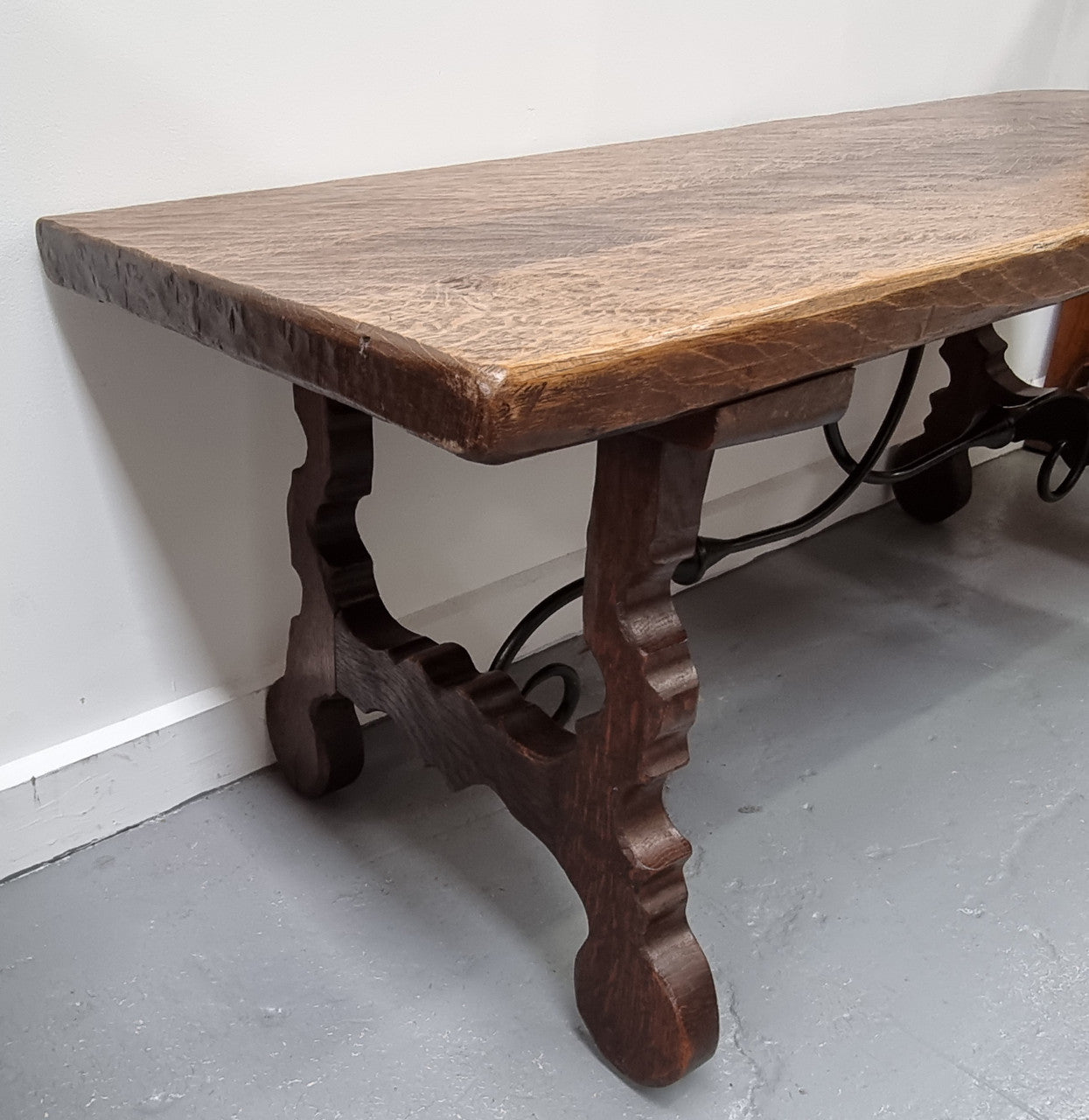 Charming French rustic Spanish style coffee table. It has an amazing rustic top and beautiful iron work. Sourced from France and is in good original detailed condition.