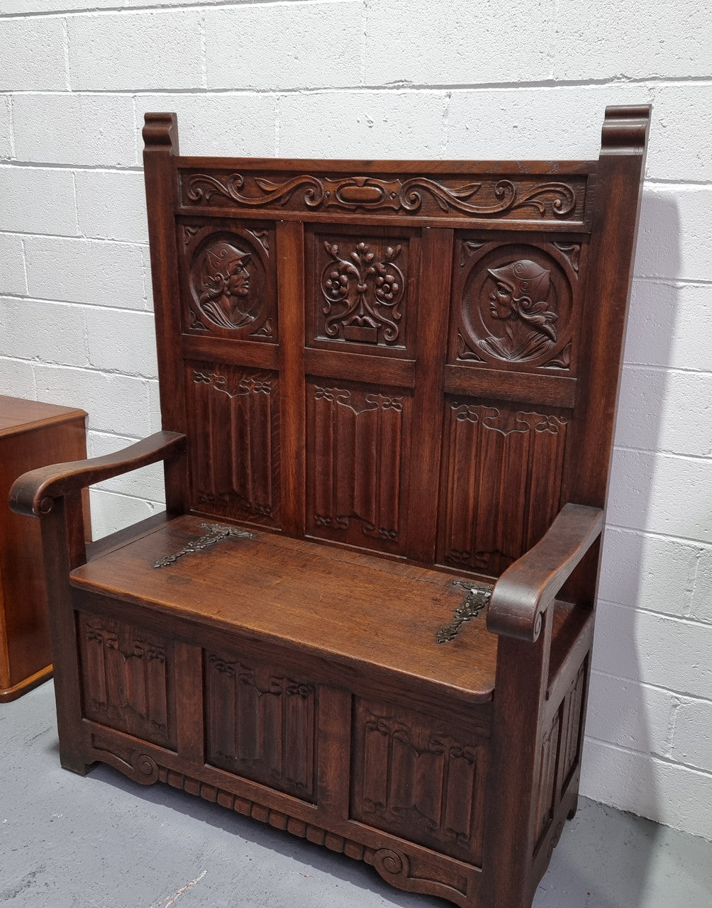 Decorative and nicely carved French Oak 19th Century hall seat with lift up lid for storage. Beautiful details and in good original detailed condition.