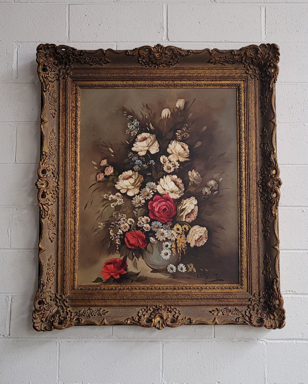 Attractive French floral oil on canvas - signed. Mounted in a stunning patterned gilded frame. It is in good original detailed condition.