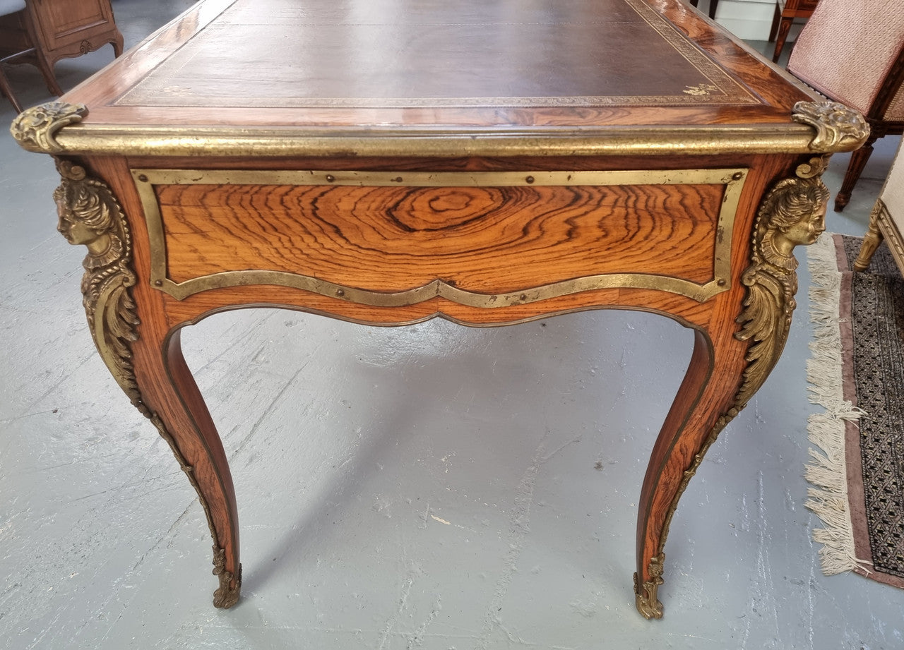 Beautifully fully restored French Antique Rosewood partners desk with beautiful ormolu detail and lovely tooled new leather top. There are three functioning drawers on one side for all your storage needs.