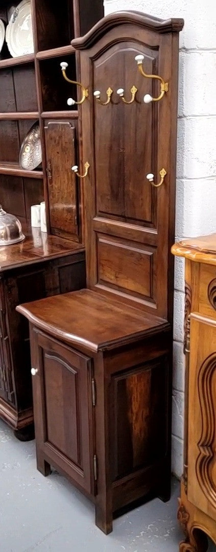 Lovely entrance piece with shelf and single door cupboard, topped with a section for hanging jackets, hats etc. Sourced from France and in good original detailed condition.