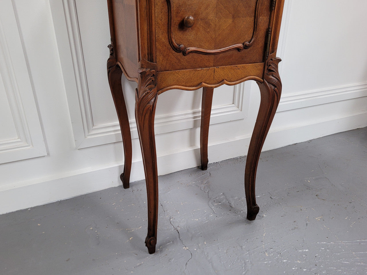 French Louis XV style Walnut single bedside cupboard with inset marble top. It has been sourced from France and is in good original detailed condition.