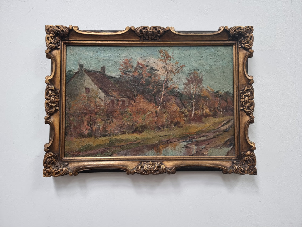 French signed country scene oil on canvas in a lovely decorative frame. In good original condition.