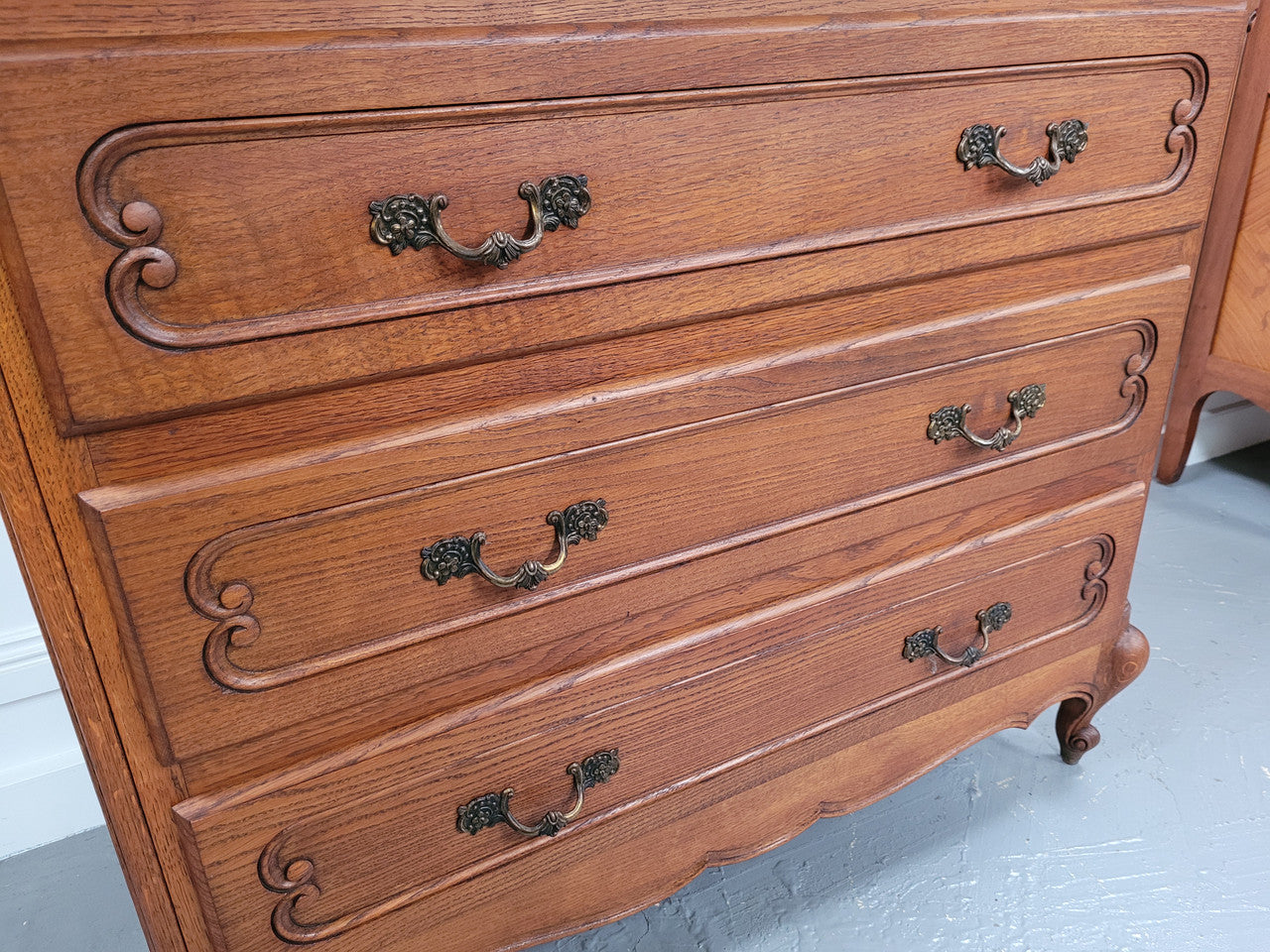 French Louis 15th style Oak three drawer chest of drawers with wooden top. It has been sourced from France and is in good original detailed condition.