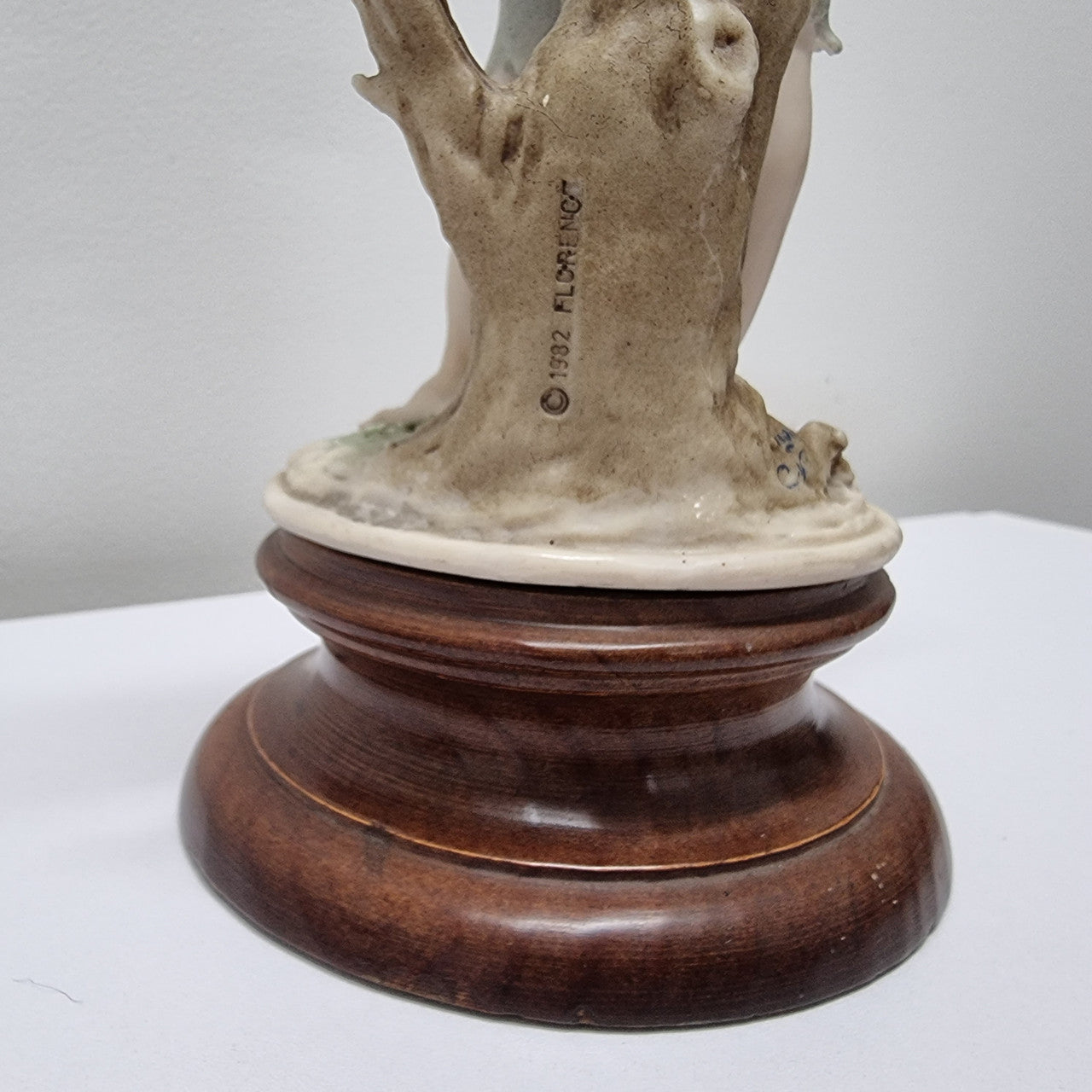 Lovely Italian figurine of boy carrying basket with grapes on a wooden base. It is signed Giuseppe Armani and 1982 FLORENCE. In good original condition. Please view photos as they form part of the description.
