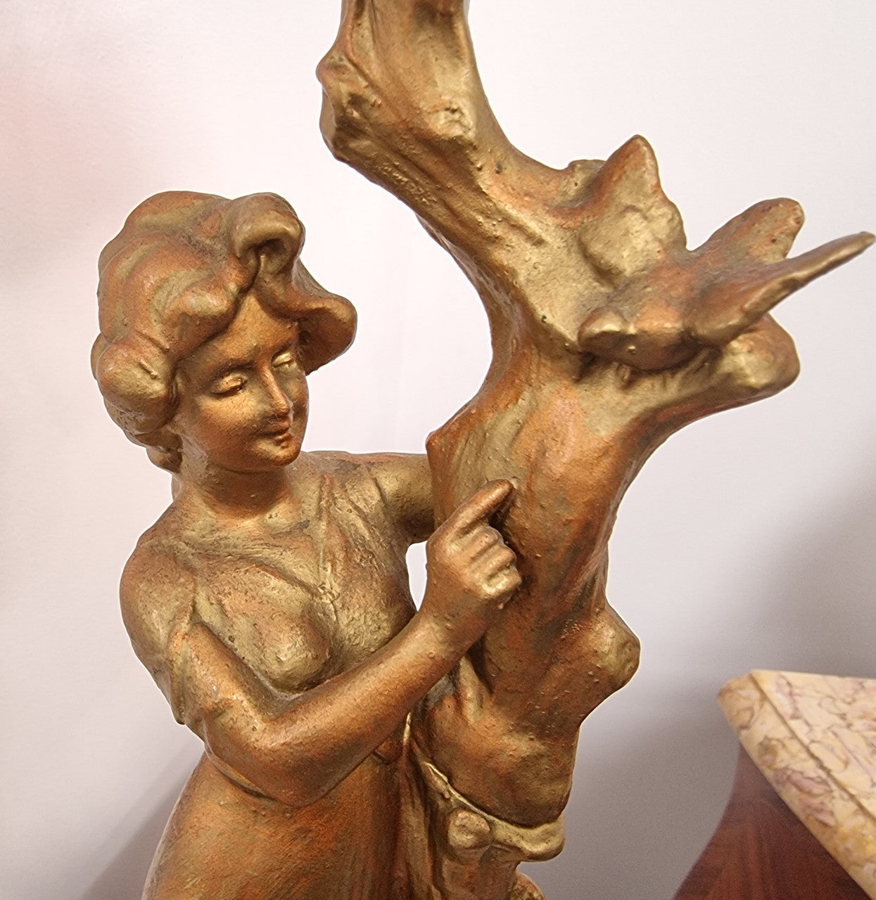 Late Victorian spelter table Centerpiece/comport featuring a woman holding an opalescent and ruby glass bowl. In good original condition with no damage to the ruby bowl.