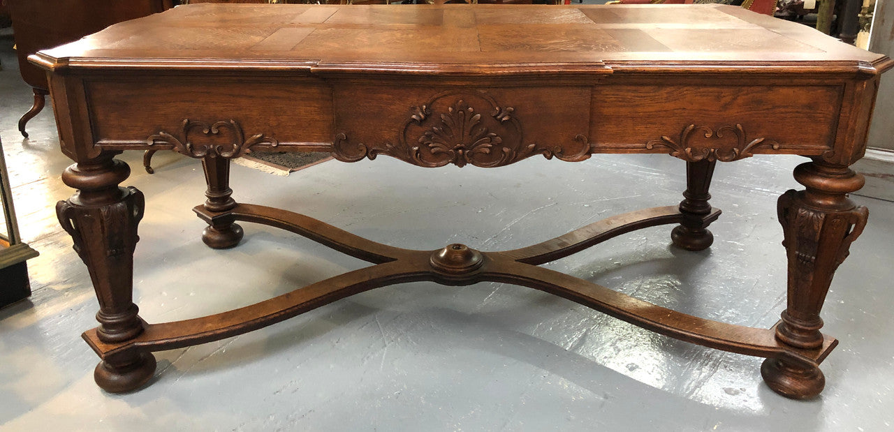 Beautifully carved 19th century French oak Bureau Plat. With a lovely parquetry top and two drawers and decorative carved legs this piece is definitely one to look at . In good original detailed condition.