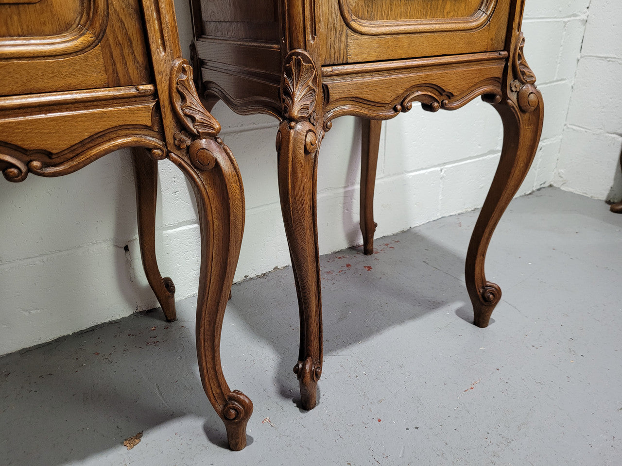 Pair of Louis XV style bedside cabinets with beautiful marble tops and one drawer and single cupboard for all your storage needs. In good original detailed condition.