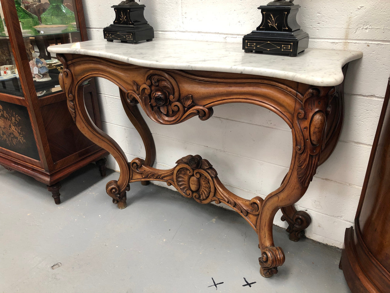 19th Century Louis XV style beautifully carved console table. With detailed ornate carving and a beautiful marble top. In good original detailed condition.