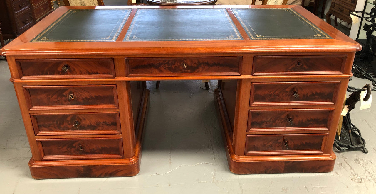 Antique French Mahogany and leather inset top double pedestal partners desk. Plenty of storage space with 9 long drawers on one side and space for someone to sit on the other side. In good restored condition. Circa 1880's.