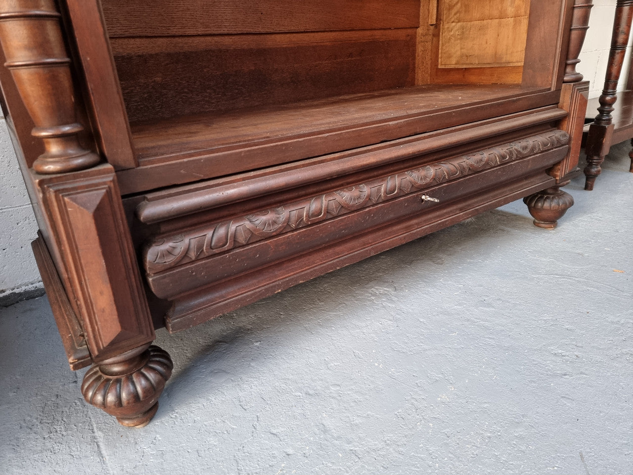 Henry II style 19th century walnut open bookcase with drawer which was originally an armoire now converted to a bookcase. It comes with four adjustable shelves. Is in good detailed condition.
