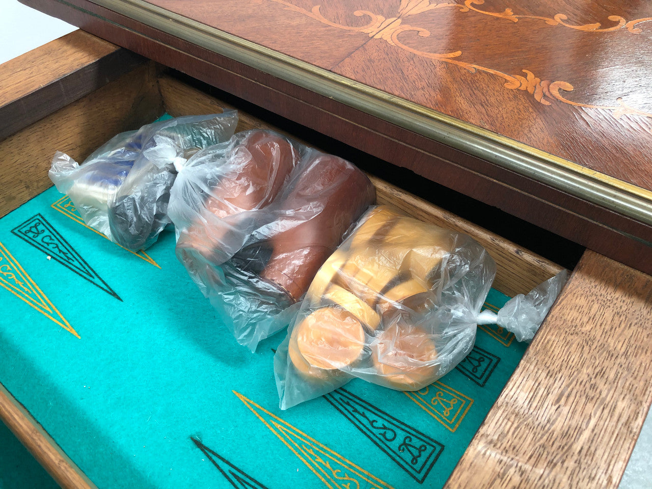 Beautiful french inlaid games table which includes internal drawers and bronze mounts. Internal drawers have counters and cards included.