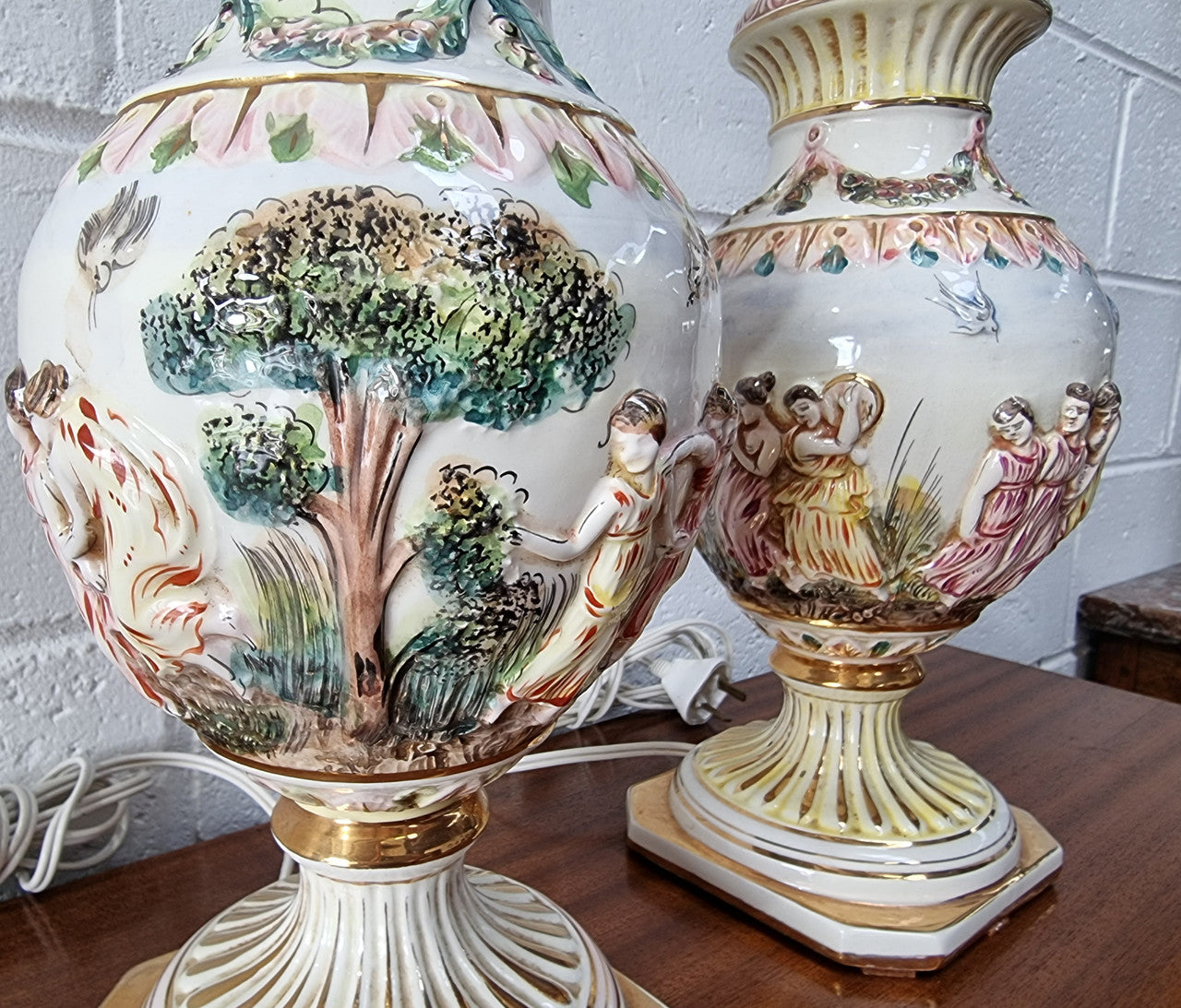 Pair of hand painted capodimonte vintage table lamps. In good original detailed working condition.
