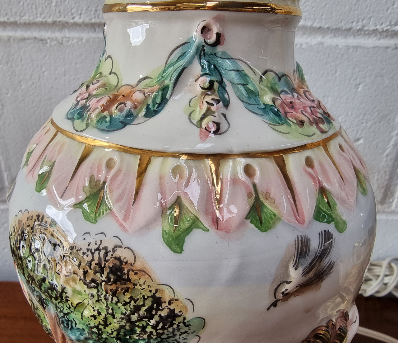 Pair of hand painted capodimonte vintage table lamps. In good original detailed working condition.