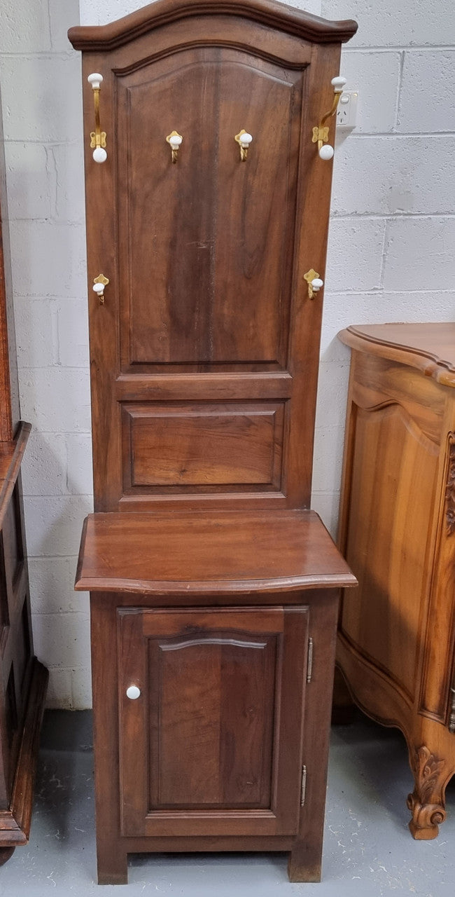 Lovely entrance piece with shelf and single door cupboard, topped with a section for hanging jackets, hats etc. Sourced from France and in good original detailed condition.