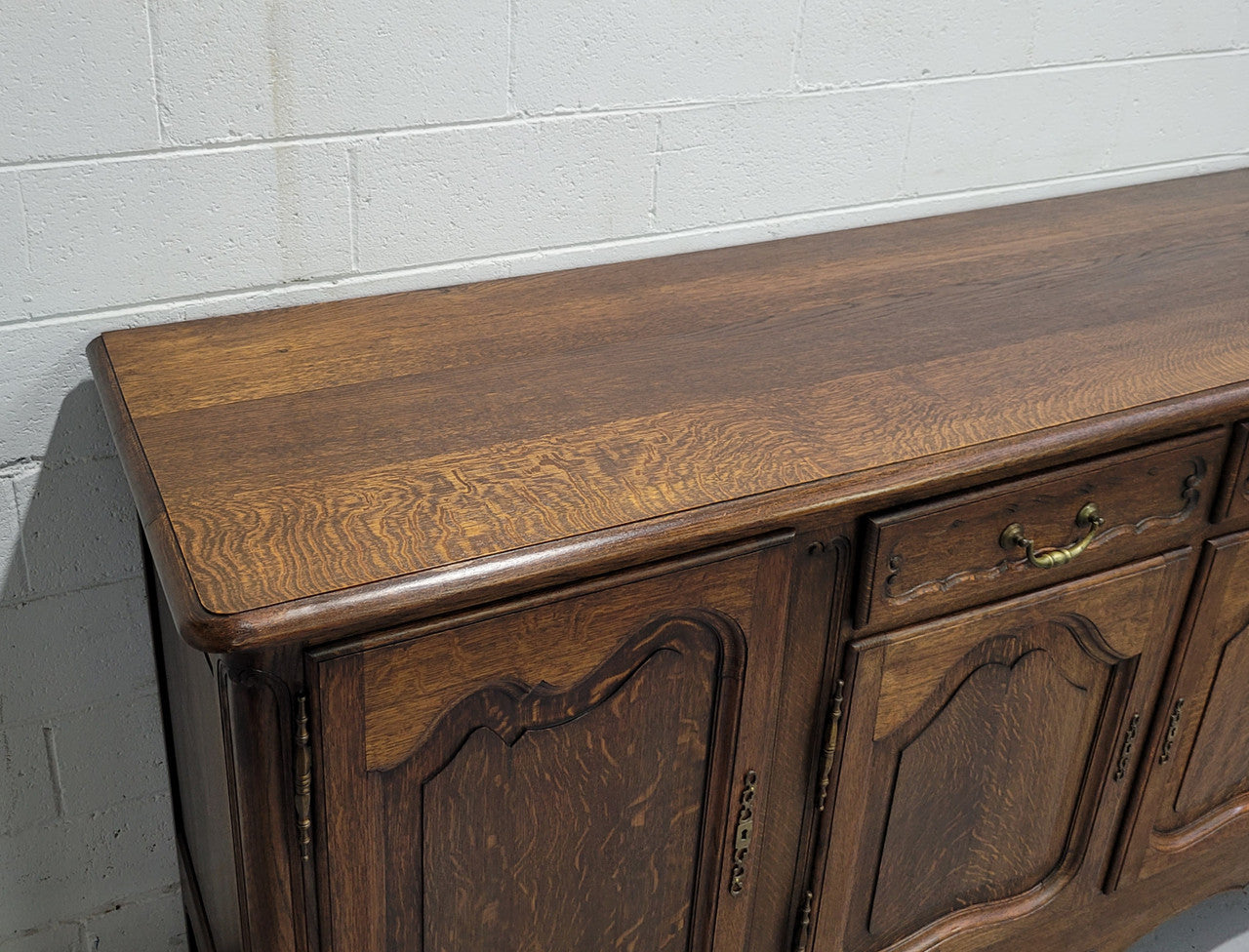 Late 19th Century French carved Oak Louis XV style four drawer sideboard. Plenty of storage space with four cupboards and two drawers. It is in good original detailed condition with all locks functioning with keys.
