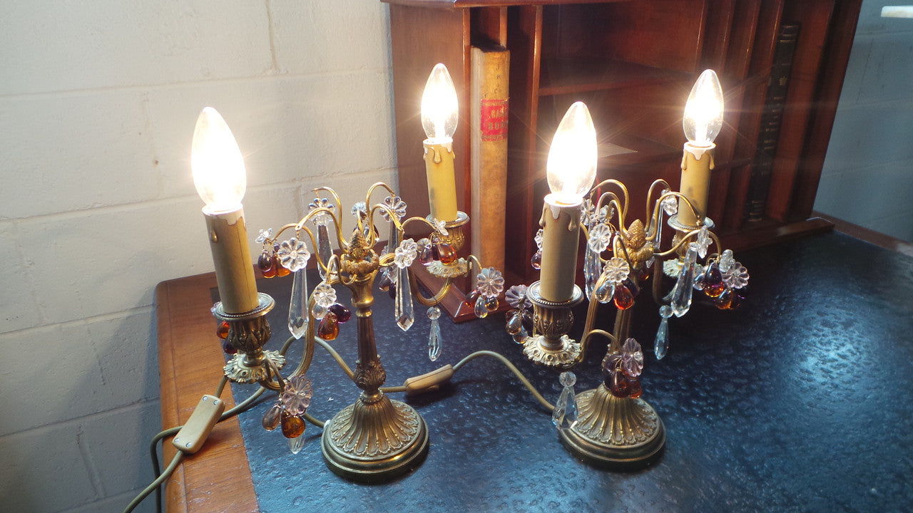 A stunning pair of French Bronze gilt Girandole candelabras, with lovely quartz drops. They are 36 cm tall and have been rewired to Australian standards. They are in very good original condition.