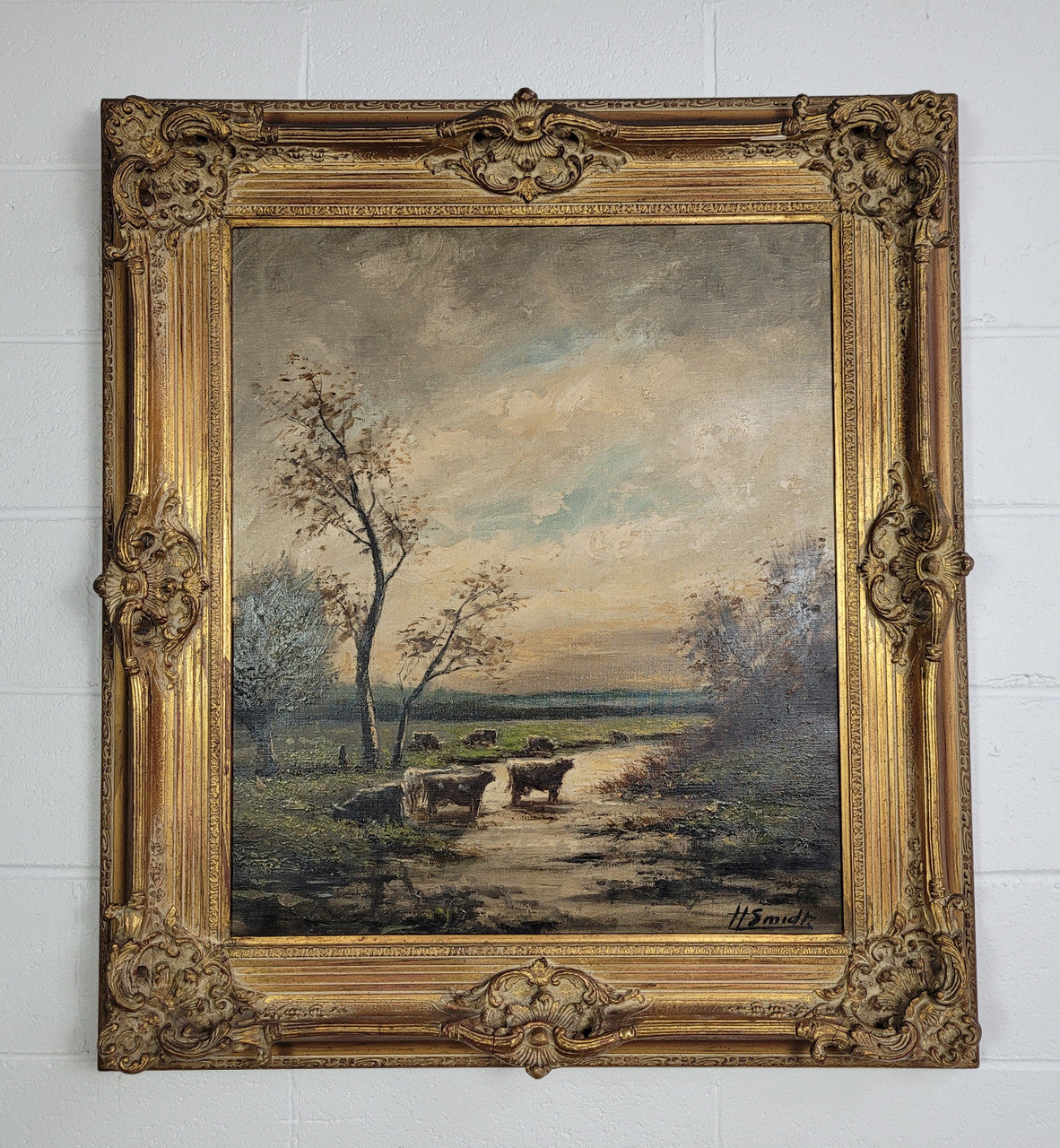 A stunning painting sourced in France signed oil on canvas of "Cows In River Landscape". Framed in a magnificent gilt frame and is in good original detailed condition.