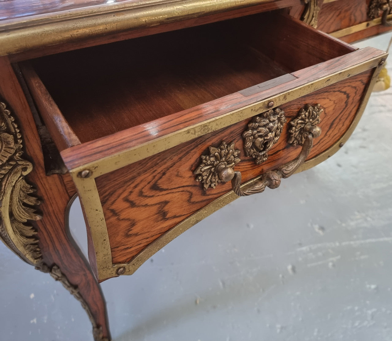 Beautifully fully restored French Antique Rosewood partners desk with beautiful ormolu detail and lovely tooled new leather top. There are three functioning drawers on one side for all your storage needs.