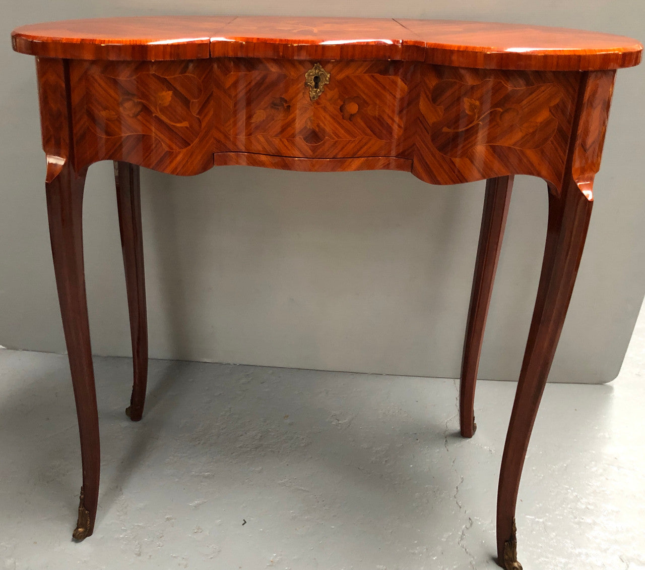 French Mahogany hidden dressing table with beautiful marquetry inlay. In good restored condition. Circa: 1950's