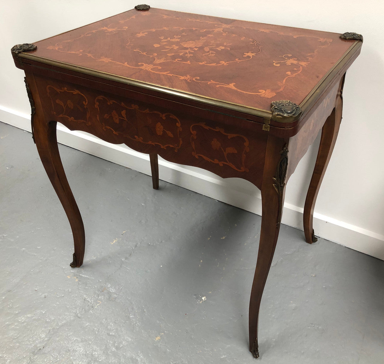 Beautiful french inlaid games table which includes internal drawers and bronze mounts. Internal drawers have counters and cards included.
