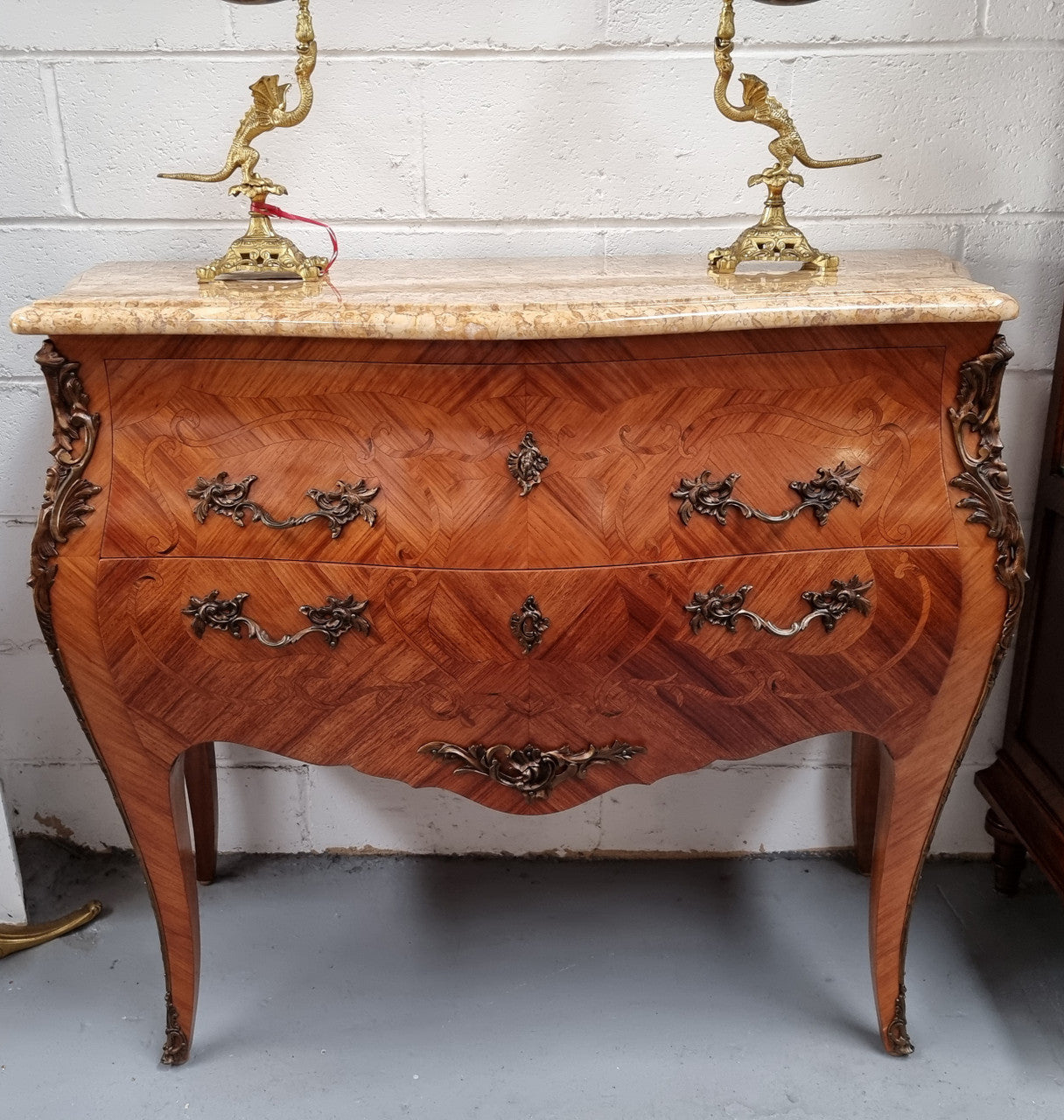 French marquetry inlaid Kingwood marble top commode. It has two drawers and beautiful mounts. Is in good original detailed condition.