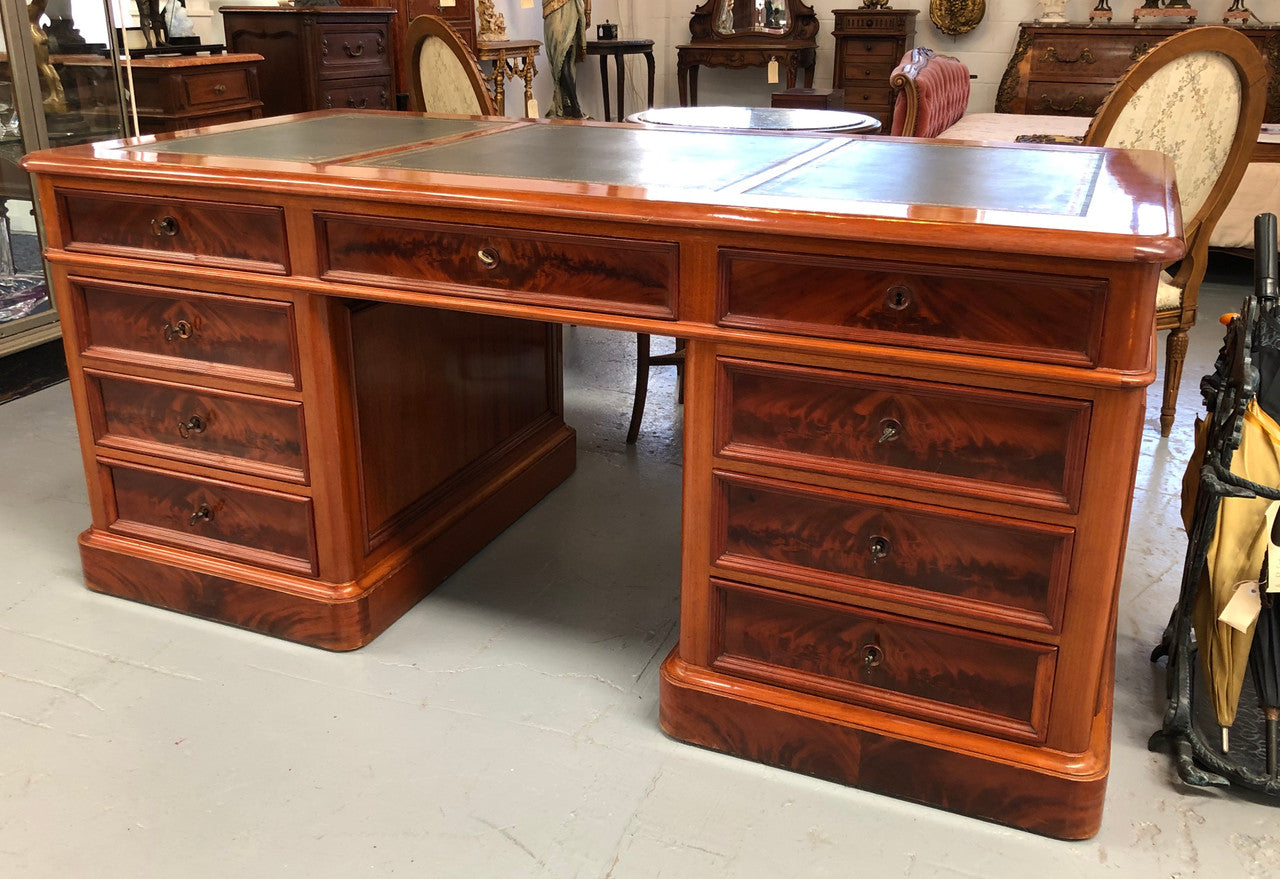 Antique French Mahogany and leather inset top double pedestal partners desk. Plenty of storage space with 9 long drawers on one side and space for someone to sit on the other side. In good restored condition. Circa 1880's.
