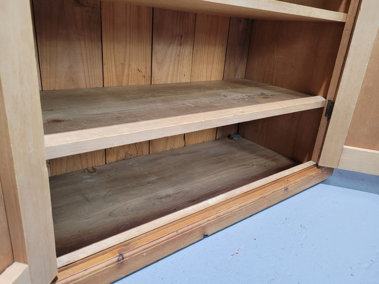 A lovely Victorian Pine shield cupboard with two doors and four shelves in good original detailed condition.