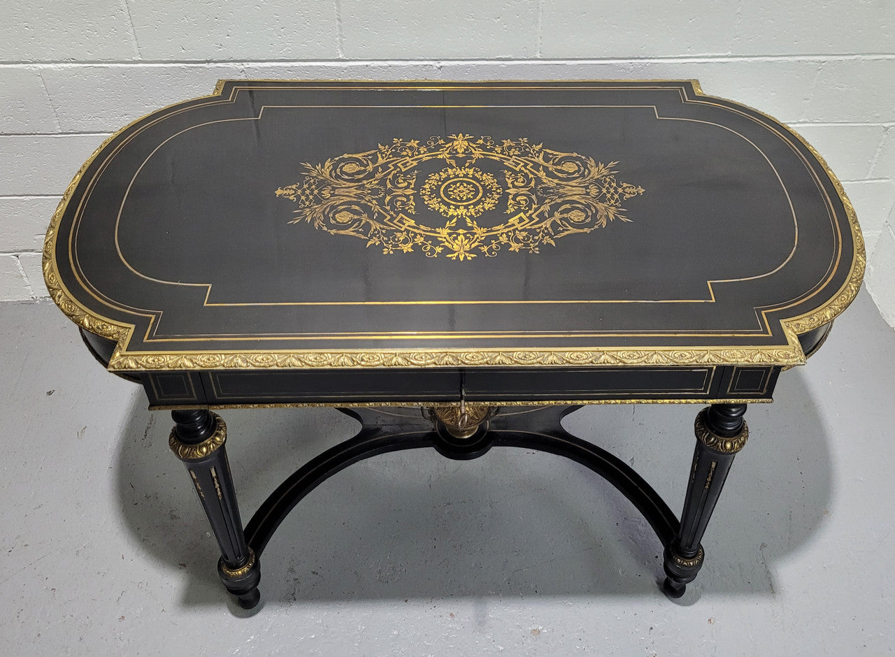 19th Century Napoleon III boulle ebonized centre table. Beautiful decorative mounts and has a drawer on one side. In good restored condition.