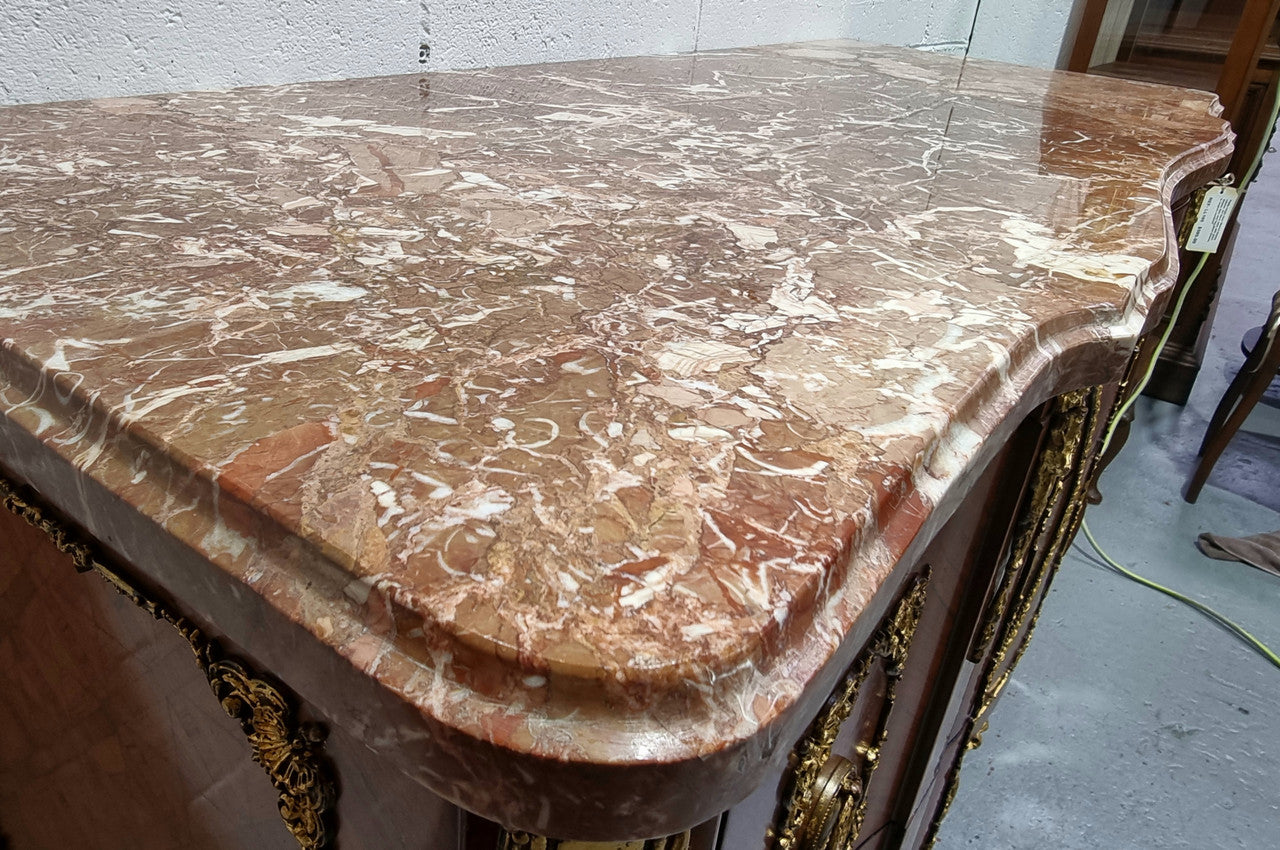 Stunning Louis XV style ormolu and marquetry marble top commode with two drawers. It has an amazing thick marble top and it is in good original detailed condition.
