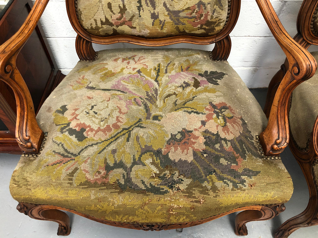 Pair of French Walnut Tapestry covered armchairs. They are in good original detailed condition. Slight wear and tear to fabric but still in good condition please view photos.