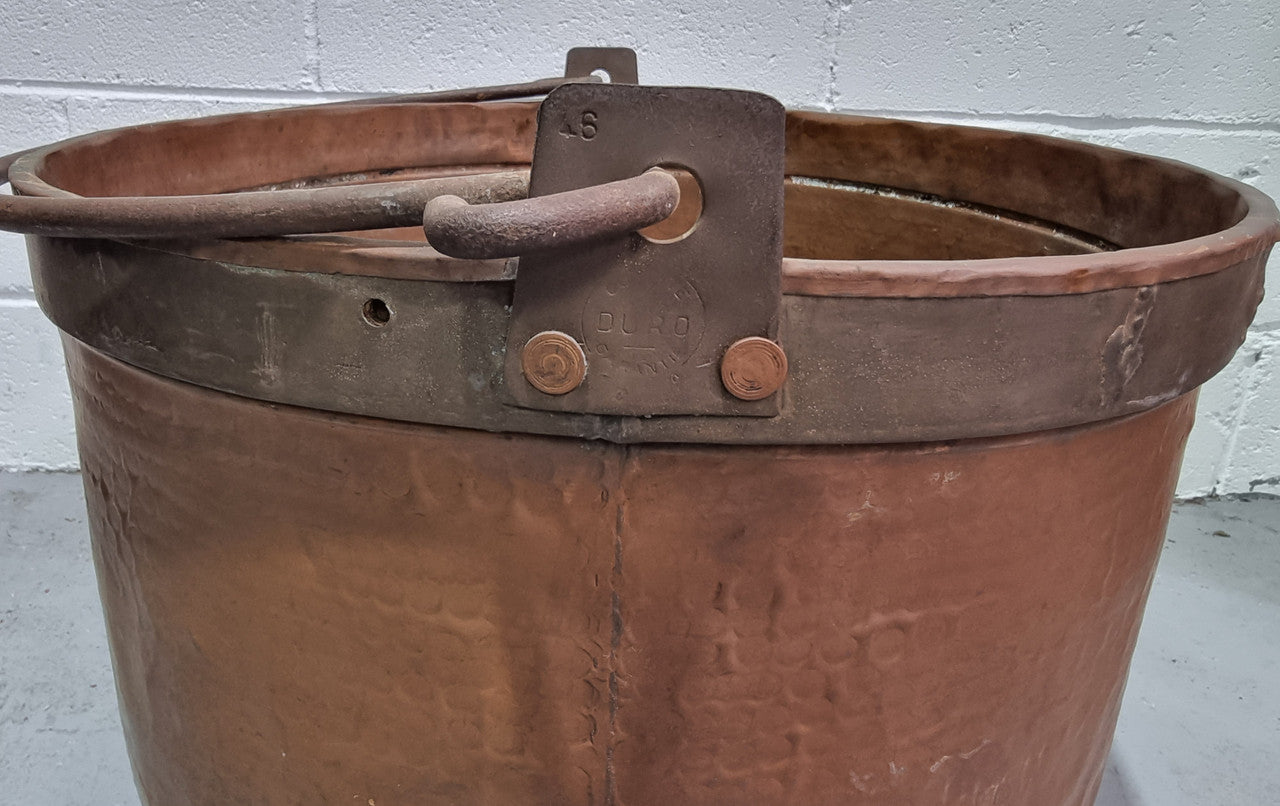 Large Antique French copper cauldron with metal band around rim. It is in good original condition.