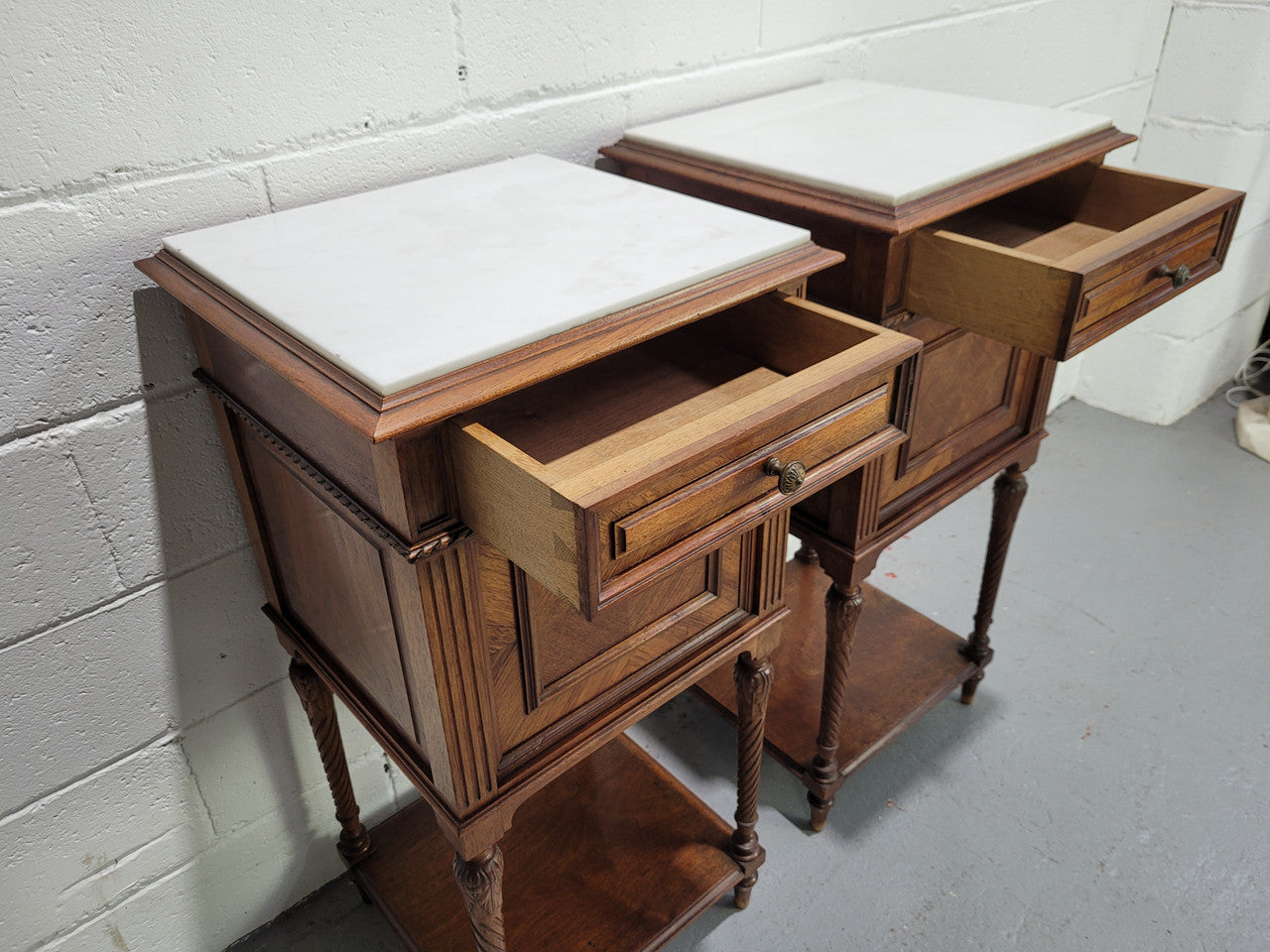 Pair parquetry Walnut bedside cabinets with white inset marble tops. In good original detailed condition.